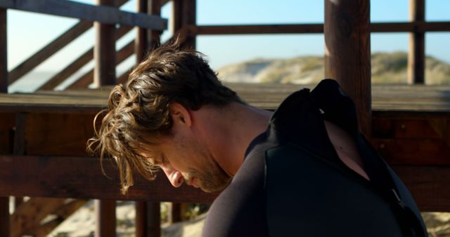 Surfer Preparing for the Waves on a Sunny Beach Day - Download Free Stock Images Pikwizard.com