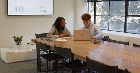 Business Colleagues Collaborating During Office Meeting