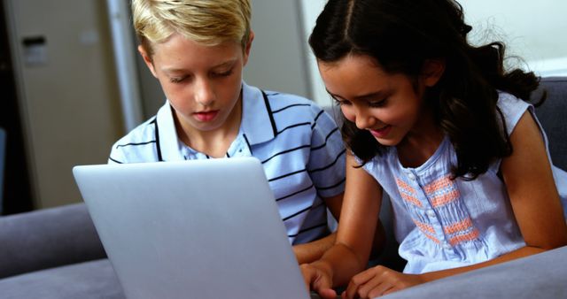Two Children Using Laptop Learning Together Indoors - Download Free Stock Images Pikwizard.com