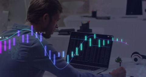 Businessman Analyzing Digital Economic Data on Laptop