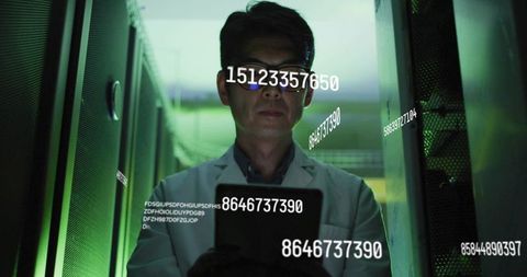 Korean technician inspecting server racks with tablet and floating data overlays