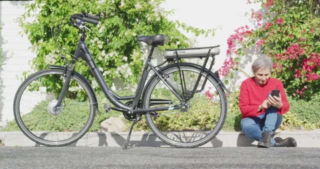 Senior Woman Resting with E-Bike and Smartphone on Street - Download Free Stock Images Pikwizard.com