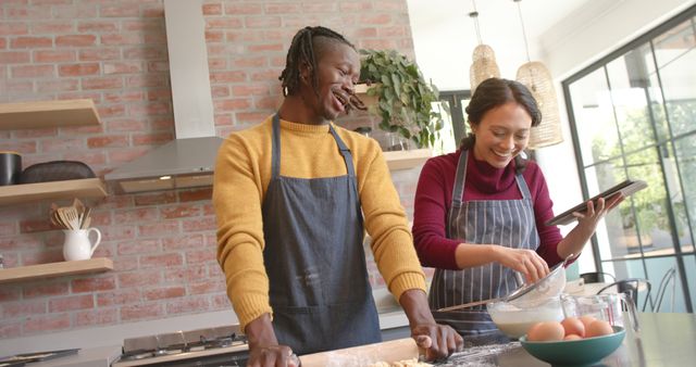 Happy Couple Baking Together in Modern Kitchen Using Tablet for Recipe Guidance - Download Free Stock Images Pikwizard.com