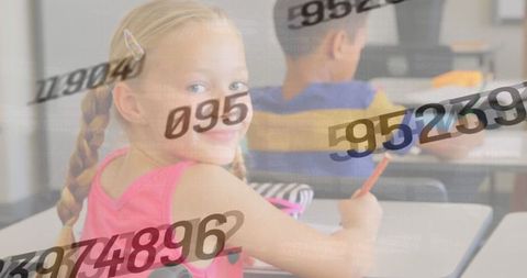 Multicultural schoolchildren engaging with digital data