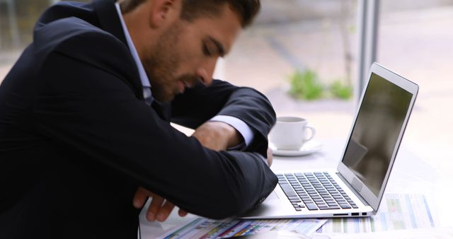 Businessman Sleeping at Desk with Laptop and Documents - Download Free Stock Images Pikwizard.com