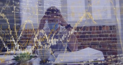 Businessman analyzing financial markets during pandemic