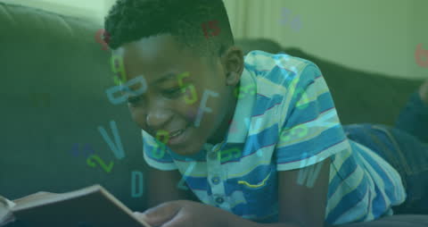 African American Boy Enjoying Reading with Animated Numbers and Letters