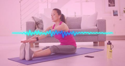Biracial Woman Practicing Yoga at Home Promoting Fitness and Well-being