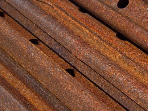 Weathered rusty metal pipes featuring old industrial texture