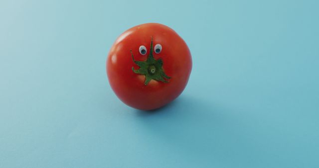 Image of fresh tomato with eyes over blue background - Download Free Stock Photos Pikwizard.com