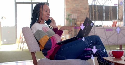 Businesswoman Strategizing Data-Driven Success in Modern Workspace