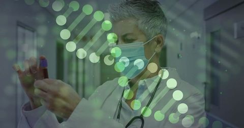 Senior doctor analyzing blood samples in research facility