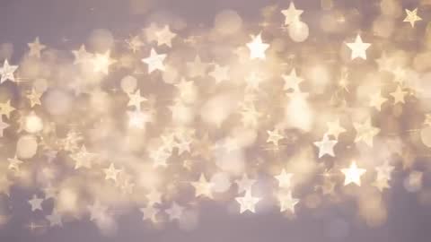 Looping Golden Star Bokeh with Drifting Light Orbs and Lavender Glow for Festive Video