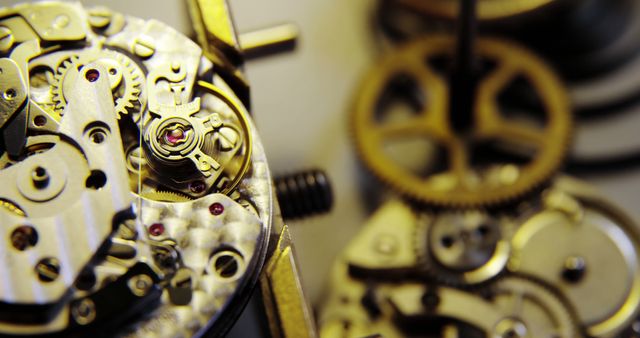 This detailed close-up view of a watch mechanism showcases the intricate arrangement of gears and cogs. Ideal for illustrating concepts in engineering, craftsmanship, and precision mechanics. Great for educational materials, advertisements for high-end watches, and articles about timepiece engineering.