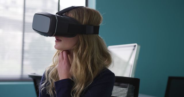 Woman Using Virtual Reality Headset in Office with Natural Light - Download Free Stock Images Pikwizard.com