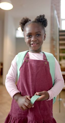 Smiling Young African American Girl at Home