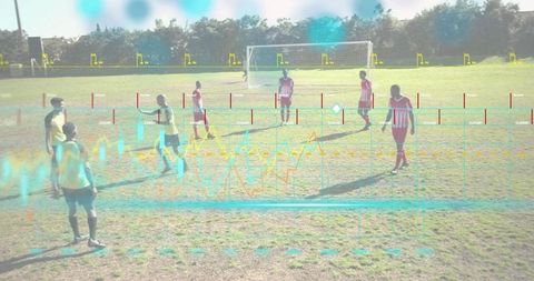 Youth soccer team analyzing performance with augmented analytics overlay on training field