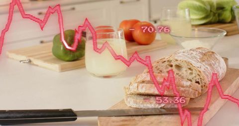 Slicing rustic ciabatta loaf on wooden board with serrated knife and overlaid market chart