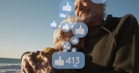 Senior couple embracing with social media likes bubble overlay