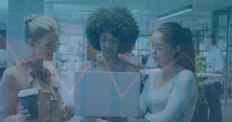 Diverse team analyzing data on laptop screen with graph overlay