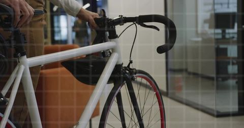 Professional Woman Navigates Office with Bicycle for Eco-Friendly Commute