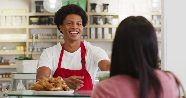 Smiling Barista Serving Customer at Cafe Counter with Croissants - Download Free Stock Images Pikwizard.com