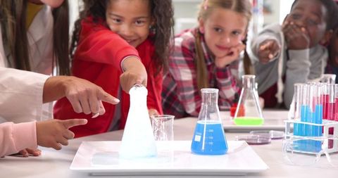 Engaged Students Learning Chemistry with Teacher in Laboratory