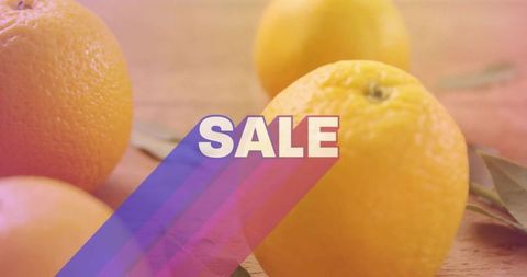 Citrus sale banner featuring ripe oranges on wood counter with colorful diagonal stripes