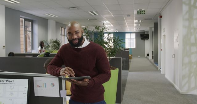 Confident Professional Man Using Tablet in Modern Office Environment - Download Free Stock Images Pikwizard.com