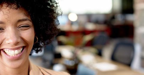 Smiling Woman in Modern Office