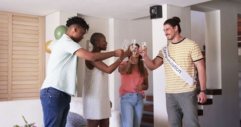 Joyful Home Gathering with Friends Toasting Champagne