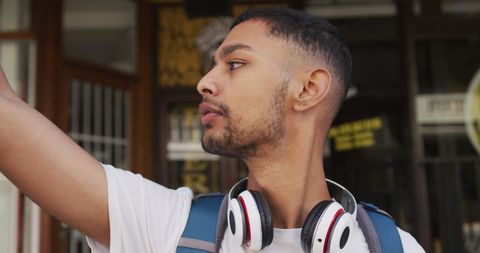 Young Traveler Taking Selfie in Urban Street