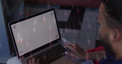 Bearded man typing on laptop with blank screen and binary code overlay cybersecurity theme