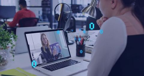 Woman watching laptop presenter during remote meeting, coworker collaborating in office
