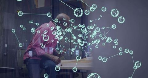 Business woman leaning behind glass reading papers, pink shirt, augmented network overlay