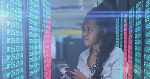 Woman Analyzing Data in high-tech Server Room - Download Free Stock Images Pikwizard.com