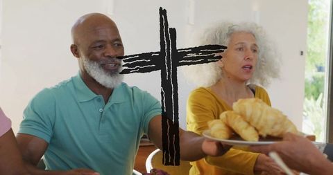 Senior Friends Enjoying Croissants and Companionship at Cozy Dining Table