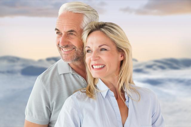 Digital composite of Smiling senior couple against sky