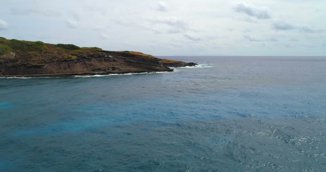 Drone vier of clear blue ocean water and rocky shore with copy space - Download Free Stock Photos Pikwizard.com