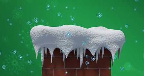 Snowflakes falling on chimney with snow against green background