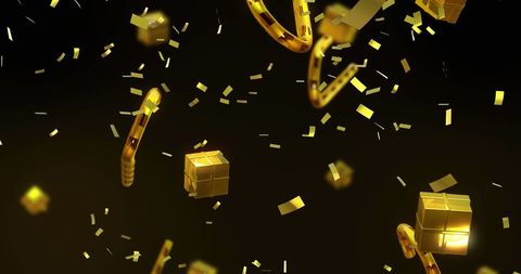 Golden Confetti Over Present Ornaments on Black Background