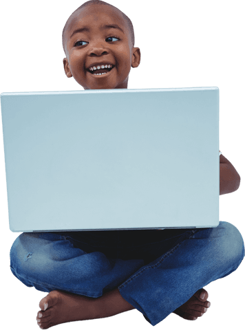 Cheerful boy sitting cross-legged with laptop on transparent background