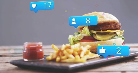 Gourmet burger and fries with floating social media notifications for food influencer content