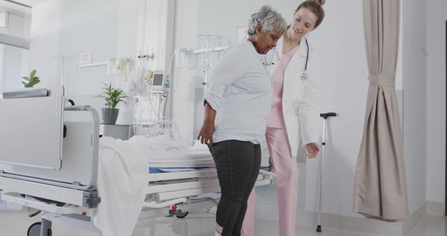 Healthcare Worker Assisting Senior Patient in Hospital Room - Download Free Stock Images Pikwizard.com