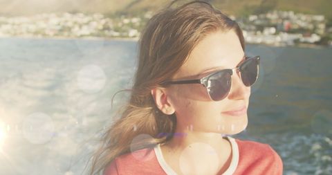 Teenager Relaxing on a Boat with Sunlit Bokeh Effects - Download Free Stock Images Pikwizard.com