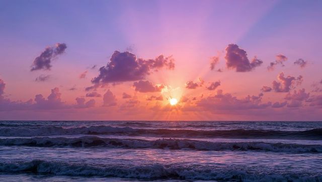 Enchanting Sunrise Over Ocean with Radiant Sky