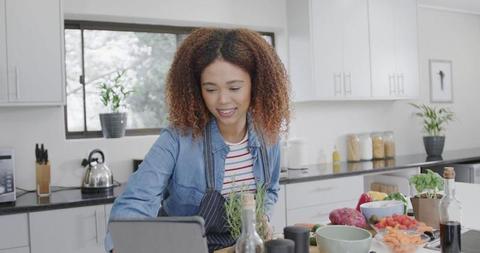 Young Woman Cooking with Tablet Recipe in Modern Kitchen - Download Free Stock Images Pikwizard.com