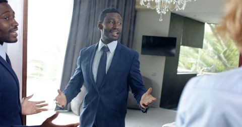 Groom and best man sharing moment before wedding ceremony