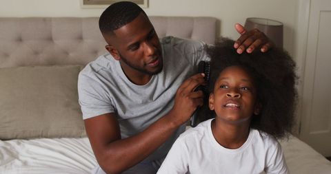 Father Carefully Styles Daughter's Hair with Tender Loving Care - Download Free Stock Images Pikwizard.com
