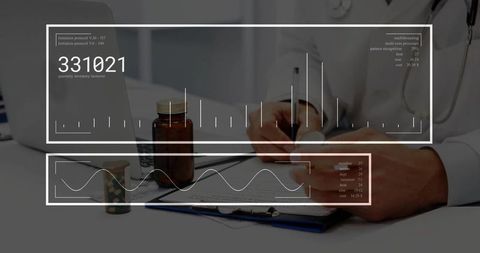 Doctor completing medical report in office with pharmaceutical items